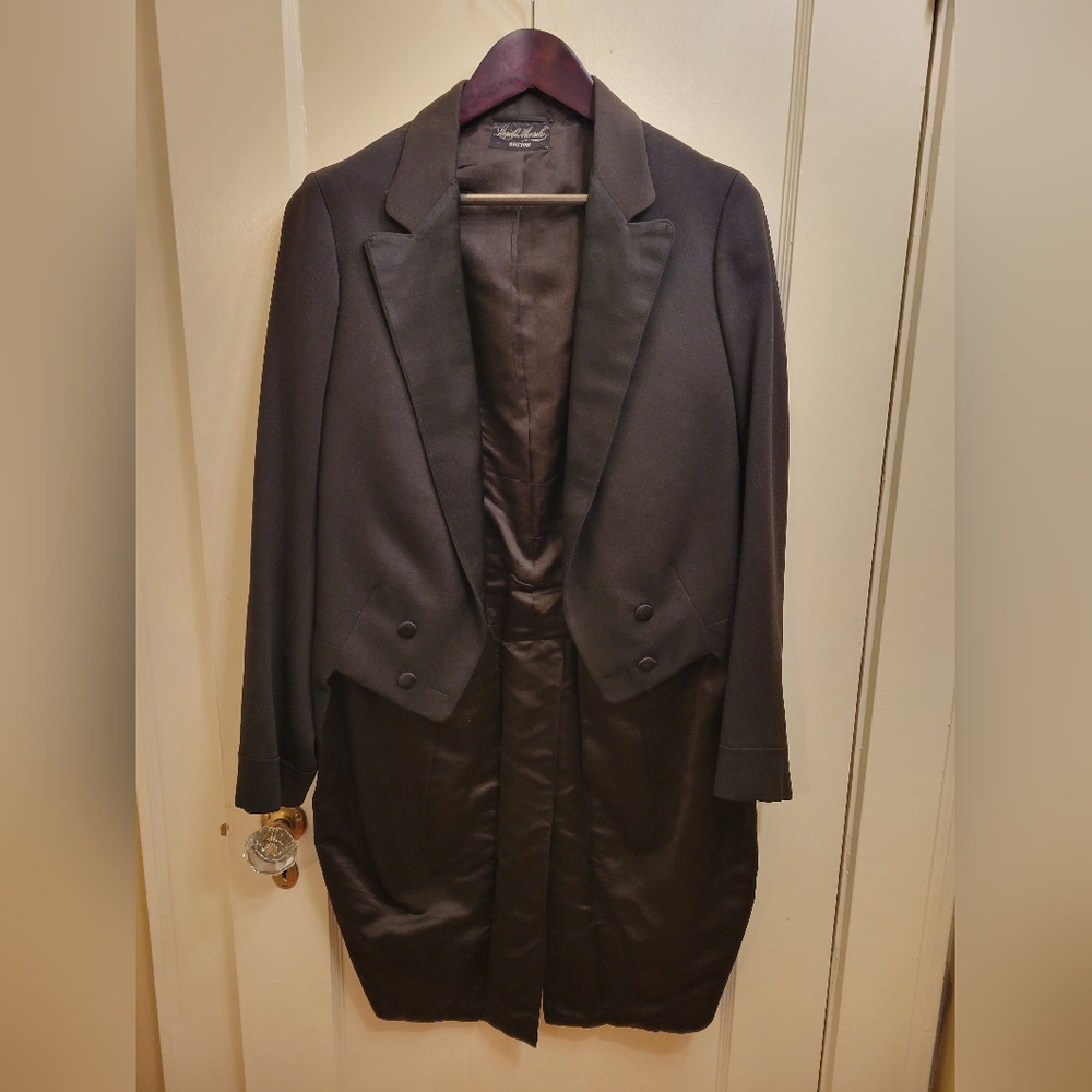 Antique 1910s tuxedo tailcoat for repair.